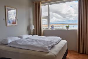 Letto o letti in una camera di Hótel Laugarvatn