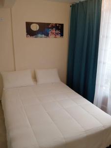 Säng eller sängar i ett rum på Apartamento Cerca Puerta del Norte