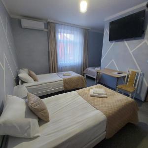 Łóżko lub łóżka w pokoju w obiekcie Perla