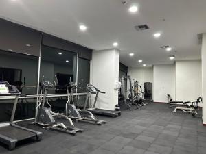 a gym with several treadmills and elliptical machines at Spacious 2 Bedroom Apartment with river views in Puerto Santa Ana River Front 2 in Guayaquil