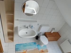 Ένα μπάνιο στο Ferienwohnung Teranga