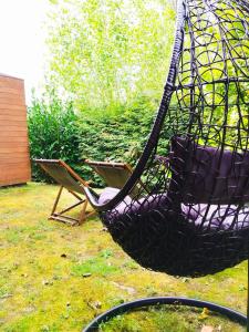 a hammock hanging from a net in a yard at Algar Carnota in Carnota