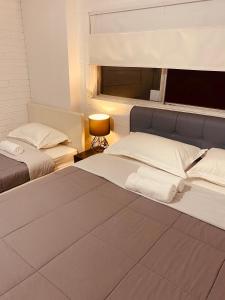 מיטה או מיטות בחדר ב-YnY Guest house