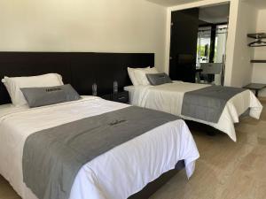 Voodi või voodid majutusasutuse Malokas Resort - Socorro - San Gil toas