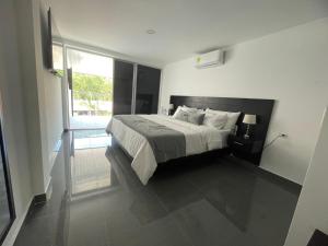 Voodi või voodid majutusasutuse Malokas Resort - Socorro - San Gil toas