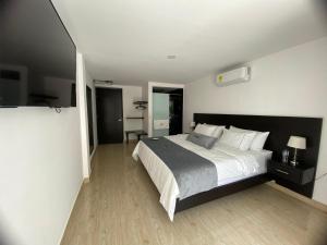 Voodi või voodid majutusasutuse Malokas Resort - Socorro - San Gil toas