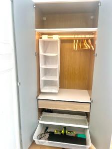 a small refrigerator with its door open with a tool at Helle Altbauwohnung, tolle Lage in Berlin