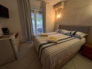 Postel nebo postele na pokoji v ubytování Apartments Gurman