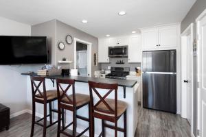 a kitchen with a counter and a refrigerator at 1203 Russ Court in Arroyo Grande