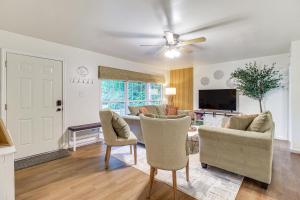 a living room with a couch and chairs at Garden City Home with Screened Porch Near Savannah! in Savannah