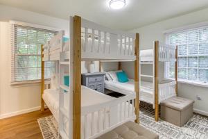 a bedroom with two bunk beds and a desk at Garden City Home with Screened Porch Near Savannah! in Savannah