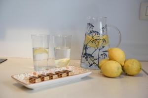 a table with a plate of food and glasses of water at Apartment Monika in Zadar