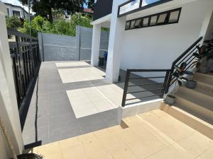 a balcony of a house with a stair railing at tagaytay transient ph in Tagaytay