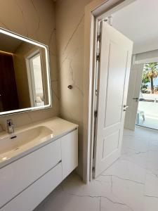 a bathroom with a sink and a mirror at Sun Island in Adeje