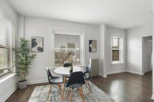 a dining room with a table and chairs at 2BR Cozy and Furnished Apt in Hyde Park - Hyde Park 405 in Chicago