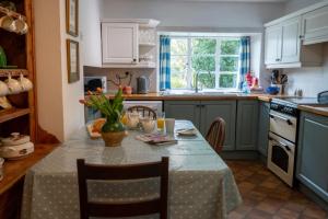 Kuchyň nebo kuchyňský kout v ubytování The Coach House + 31 fotografií