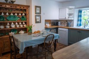 Kuchyň nebo kuchyňský kout v ubytování The Coach House