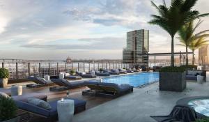 a hotel rooftop with a pool and lounge chairs at Petco, City, Ocean Views! Gaslamp at it's finest! in San Diego