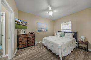 Rúm í herbergi á Marlin Key 4C by Vacation Homes Collection