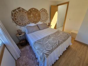 Postel nebo postele na pokoji v ubytování Casiña Ermi