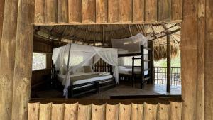 Postel nebo postele na pokoji v ubytování Wachakyta Ecolodge