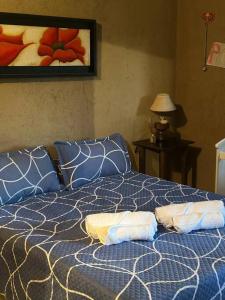 Un pat sau paturi într-o cameră la Casa Barrio Medrano 5Pax Chacras By Inside
