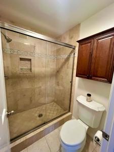 a bathroom with a shower and a toilet at Rose Garden Home, Entire 4bdr 2bth House with Offices, Thousand Oaks in Thousand Oaks +19 photos