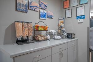 a counter with baskets on it in a store at Microtel Inn & Suites by Wyndham Albertville in Albertville