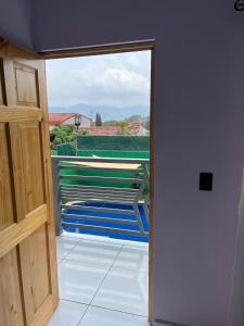 an open door to a balcony with a view at Casa monte sion in Nueva San Salvador