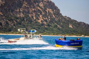 a group of people riding on a boat in the water at Mandarin Oriental, Costa Navarino in Pylos