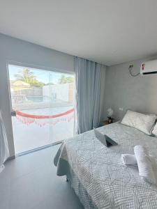 Säng eller sängar i ett rum på Solaris Serrambi Flats