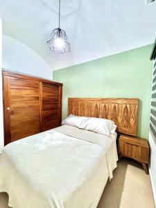 A bed or beds in a room at Sweet home Ixtapa comfort
