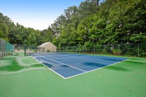 a tennis court with a tennis court at Clearwater --- 33959 Monterray in Frankford