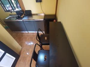 an overhead view of a room with a table and a laptop at Permata Beach Chalet in Kampong Juara