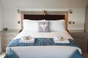 En eller flere senge i et værelse på Stunning House in Clanfield