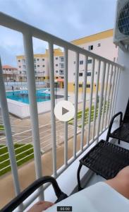 a balcony with a view of a swimming pool at Cantinho de paz in Santarém