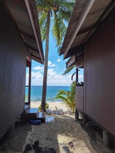 a view of the beach from a resort building at Permata Beach Chalet in Kampong Juara