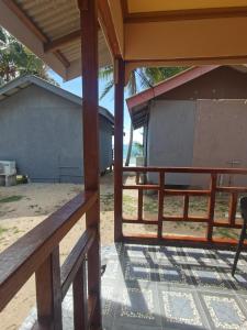 a view from the porch of a house at Permata Beach Chalet in Kampong Juara