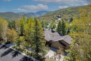 an aerial view of a house with mountains in the background at Centrally Located, Close to Ski, Main Street, Free Resort Shuttle with Hot Tub in Park City