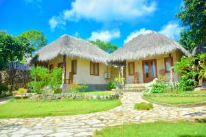 Taman di luar Mulia Bungalows +26 gambar