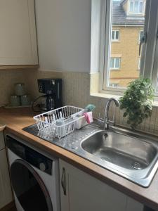 a kitchen counter with a sink and a window at Luxury Rooms And An En-Suite Room With Free WI-FI Clarendon Way in Colchester