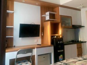 Η κουζίνα ή μικρή κουζίνα στο Agrippina Rooms T a m a n Melati Apartement near Malioboro +9 φωτογραφίες