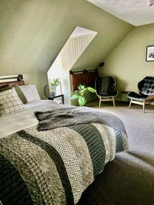 Voodi või voodid majutusasutuse Auberge des Cantons toas