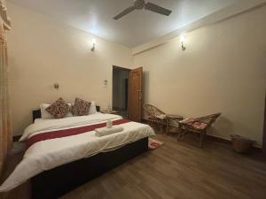Voodi või voodid majutusasutuse Cherry Garden Pokhara toas