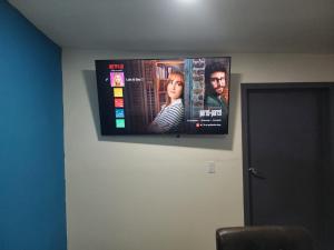 a flat screen tv hanging on a wall at Ocean blue in San Felipe