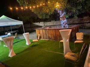 a backyard with chairs and a tent and lights at Suncress Bed and Breakfast in Kingston