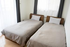 Postel nebo postele na pokoji v ubytování apartment hotel myu