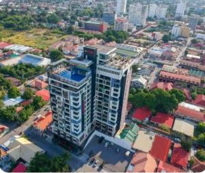 an overhead view of a tall building in a city at One Euphoria walking st Condotel Angeles city in Angeles