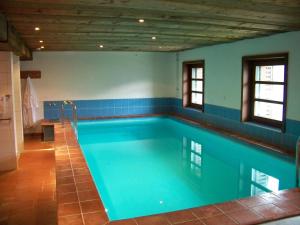 a large swimming pool in a room with at Gästehaus Bichl in Umhausen