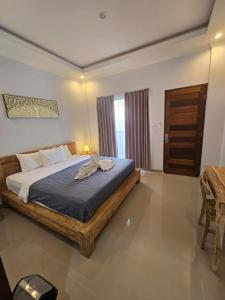 a bedroom with a large bed in a room at The Lucky Canggu 2 in Canggu +19 photos